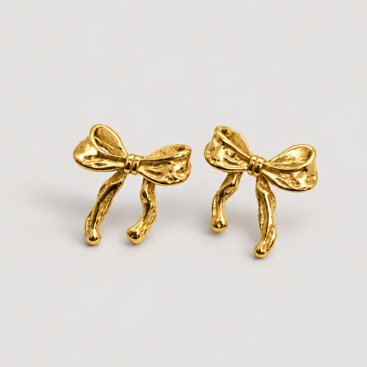 Baby Bow Earrings — studio product photograph