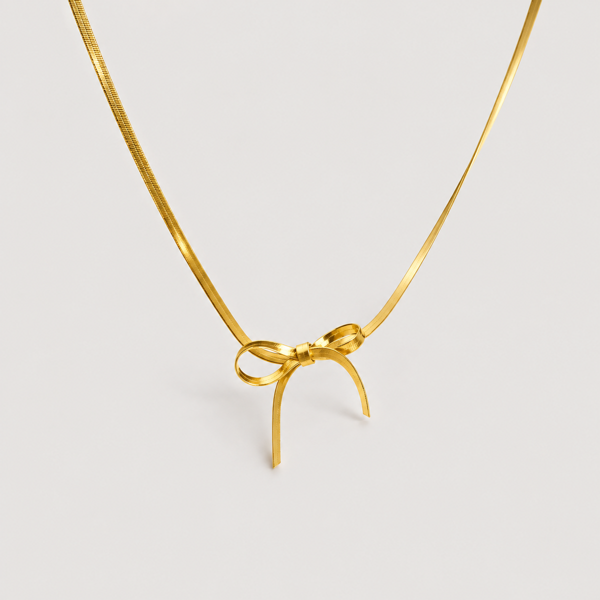 Carol Bow Necklace — studio product photograph