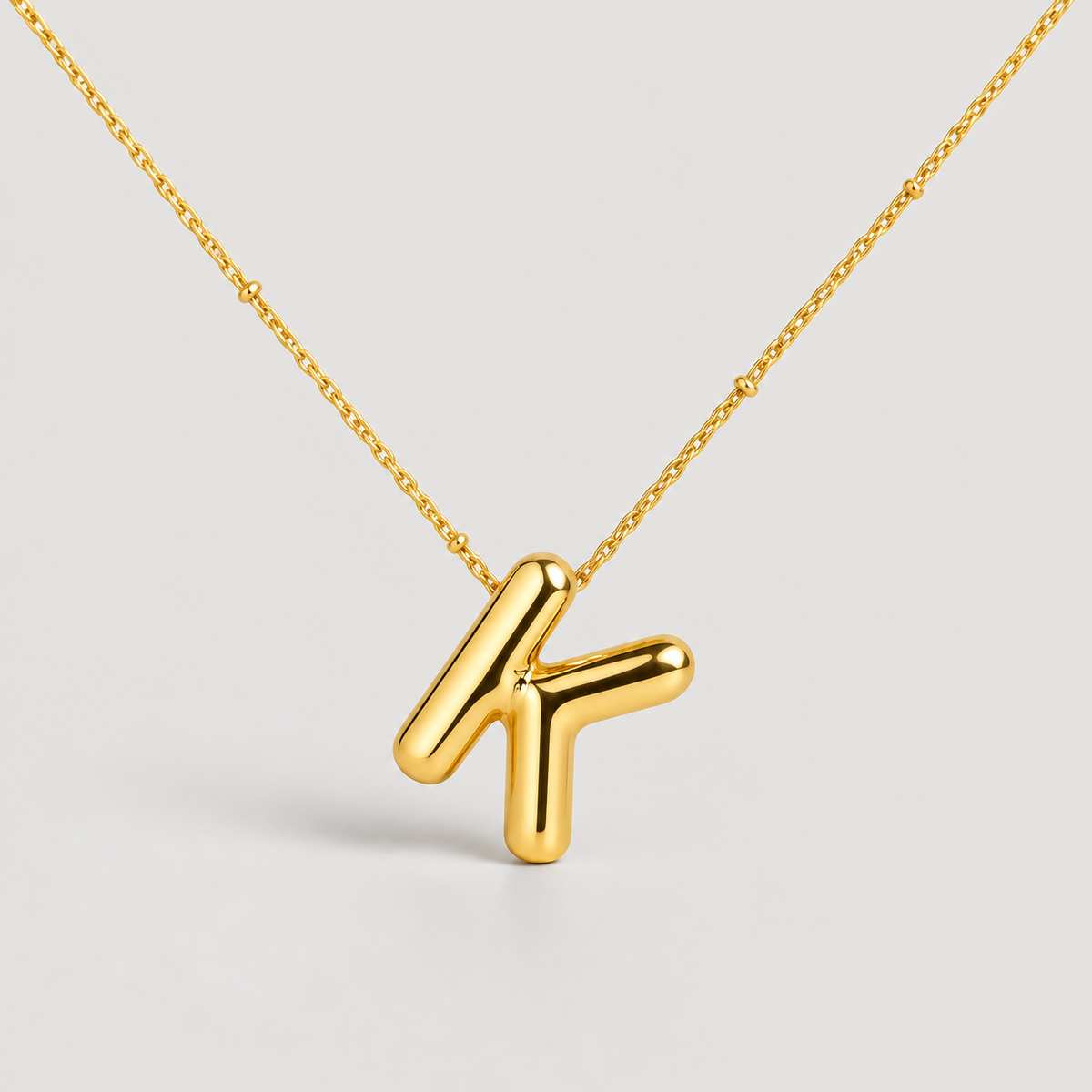 Bubble Letter Initial Necklace — studio product photograph