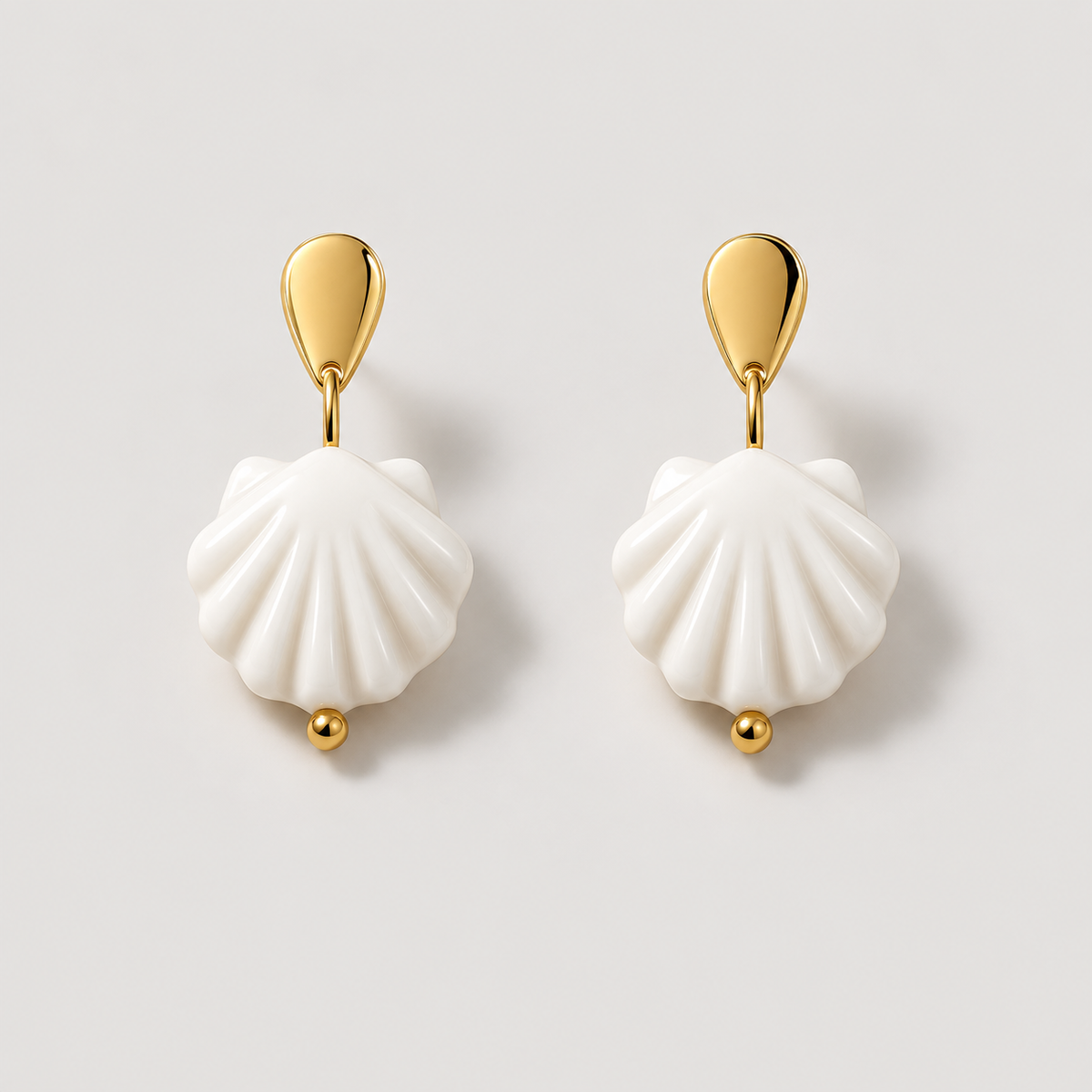 Scallop Earrings — studio product photograph